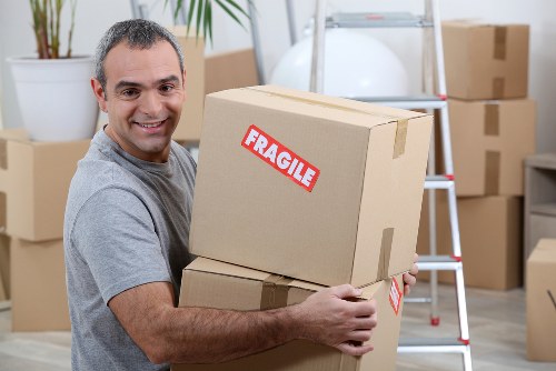 Office removals planning in Hackney with moving boxes and workstations