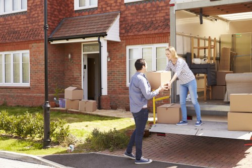 Removal van loading furniture in a Hackney residential street