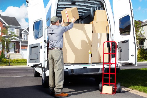 Furniture and boxes being transported by a Hackney van service