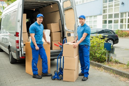 Careful loading of household items into a moving truck in Hackney