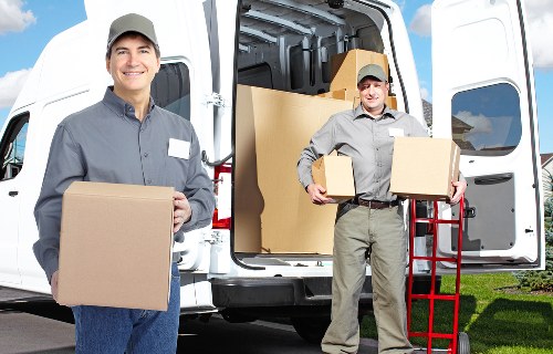Commercial moving team handling office furniture in Hackney