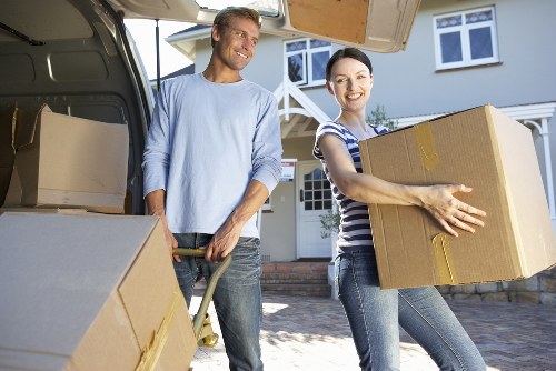 Hackney moving team loading furniture into a van
